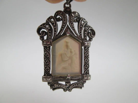 Art Deco pendant medal with mother-of-pearl Virgin in openwork chapel. Marcasites stones