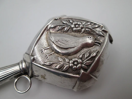 Baby rattle with handle. 835 sterling silver. Duck with flowers and leaves. Portugal. 1980's