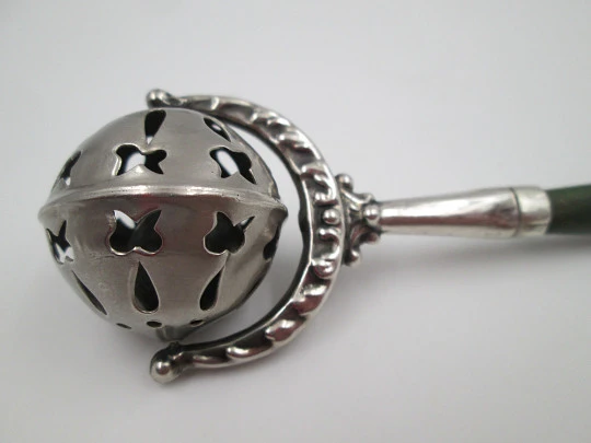 Baby rattle with handle. Sterling silver & bitone resin. Sphere with drops and butterflies