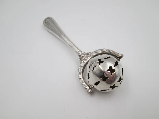 Baby rattle with handle. Sterling silver. Vegetable motifs. Openwork sphere. 1980's