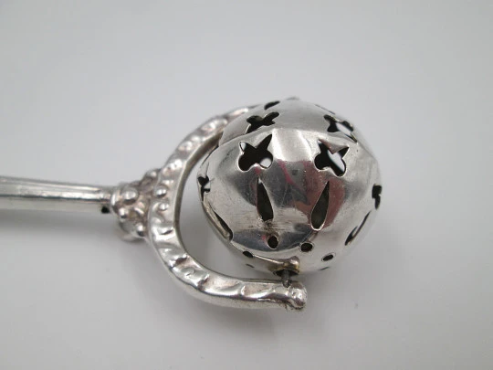 Baby rattle with handle. Sterling silver. Vegetable motifs. Openwork sphere. 1980's