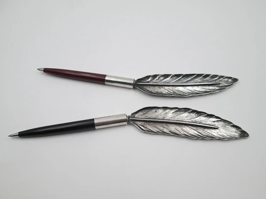 Bird's feather shape ballpoint pen holders. Silver plated and colours plastic. Spain. 1980's