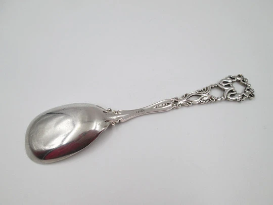 Bruckmann & Söhne long silver spoon with openwork handle. Cherub finish. 1910's