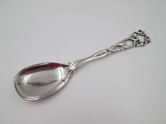 Bruckmann & Söhne long silver spoon with openwork handle. Cherub finish. 1910's