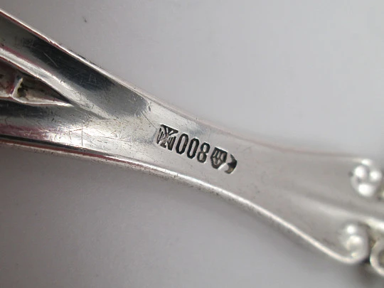 Bruckmann & Söhne long silver spoon with openwork handle. Cherub finish. 1910's