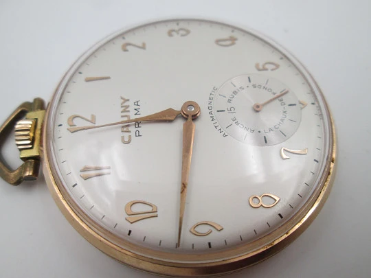 Cauny Prima. Gold plated metal. Manual wind. Small seconds hand. Ornate back. 1960's