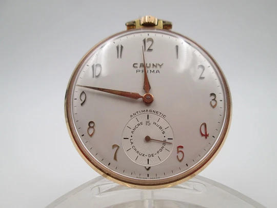 Cauny Prima. Gold plated metal. Manual wind. Small seconds hand. Ornate back. 1960's