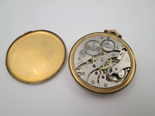 Cauny Prima. Gold plated metal. Manual wind. Small seconds hand. Ornate back. 1960's