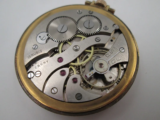 Cauny Prima. Gold plated metal. Manual wind. Small seconds hand. Ornate back. 1960's