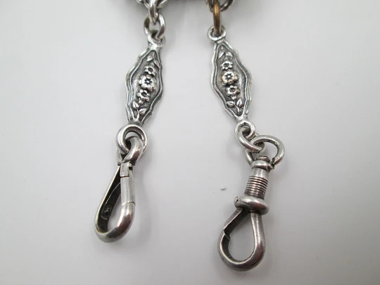 Chatelaine with four bodies. Silver copper. Belt hook and chains with carabiners. 1900's