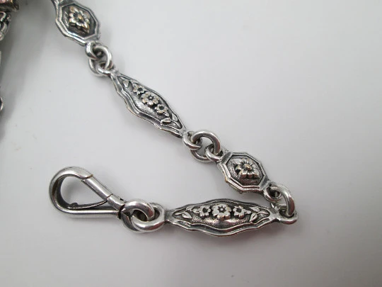 Chatelaine with four bodies. Silver copper. Belt hook and chains with carabiners. 1900's