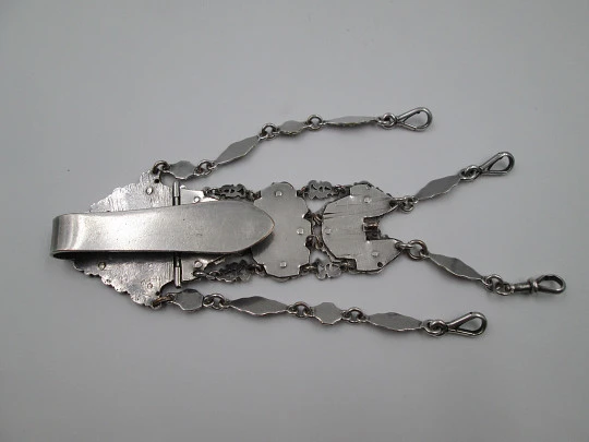 Chatelaine with four bodies. Silver copper. Belt hook and chains with carabiners. 1900's