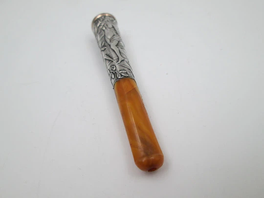 Cigarette mouthpiece. Sterling silver, amber and gold edge. River nymph. Europe. 1900's