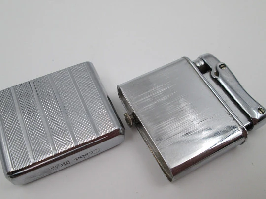 Colibri Monopol pocket petrol lighter. Silver plated. Geometric pattern. England. 1950's