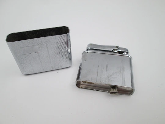 Colibri Monopol pocket petrol lighter. Silver plated. Geometric pattern. England. 1950's