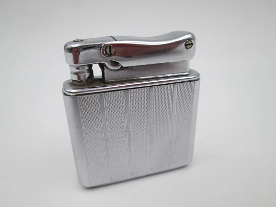 Colibri Monopol pocket petrol lighter. Silver plated. Geometric pattern. England. 1950's