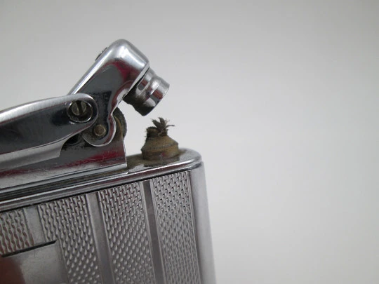 Colibri Monopol pocket petrol lighter. Silver plated. Geometric pattern. England. 1950's