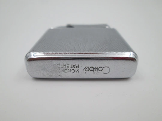 Colibri Monopol pocket petrol lighter. Silver plated. Geometric pattern. England. 1950's