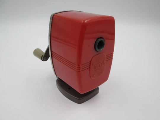 Coronet III (Velos) desk pencil sharpener. Red plastic and bitone metal. England. 1950's