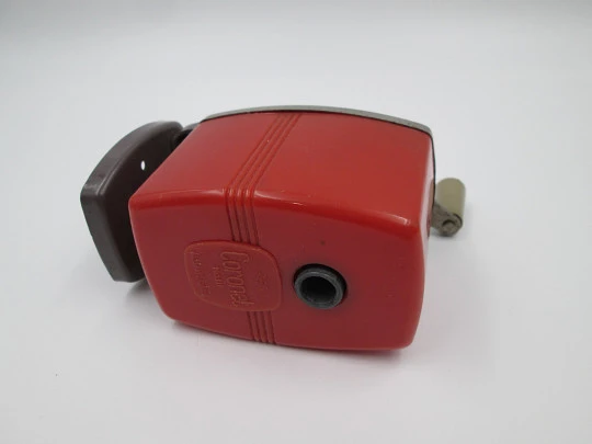 Coronet III (Velos) desk pencil sharpener. Red plastic and bitone metal. England. 1950's