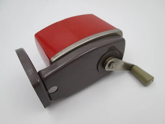 Coronet III (Velos) desk pencil sharpener. Red plastic and bitone metal. England. 1950's