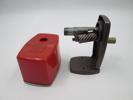 Coronet III (Velos) desk pencil sharpener. Red plastic and bitone metal. England. 1950's