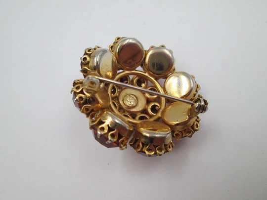 Dag women's brooch. Gold plated metal. White and orange rhinestones. USA. 1960's