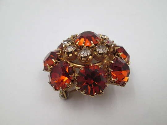 Dag women's brooch. Gold plated metal. White and orange rhinestones. USA. 1960's