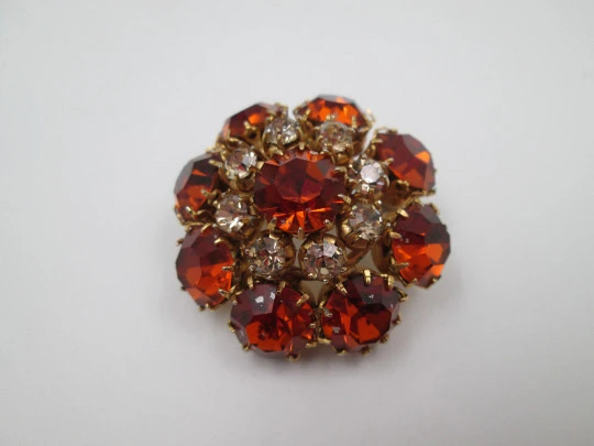 Dag women's brooch. Gold plated metal. White and orange rhinestones. USA. 1960's