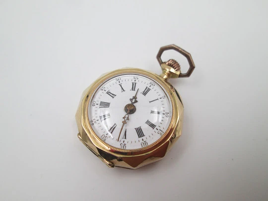 Decagonal pocket watch. 14k yellow gold. Stem-wind. Porcelain dial. Floral motifs. 1890