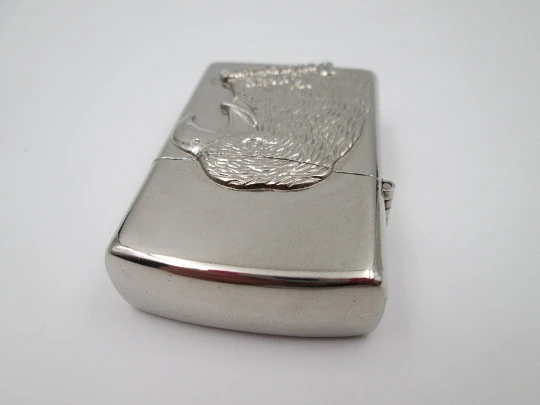 Eagle Double Flame butane torch pocket lighter with bird relief motif. Chromed plated