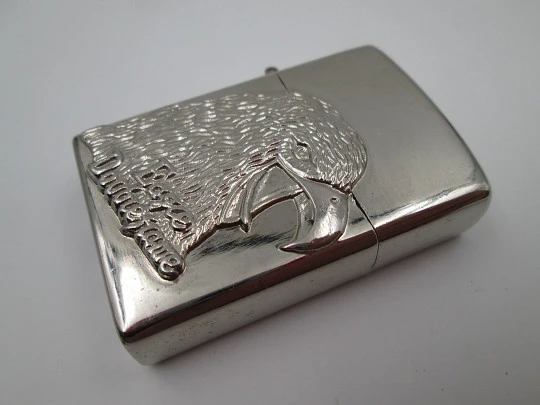 Eagle Double Flame butane torch pocket lighter with bird relief motif. Chromed plated