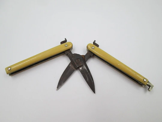 Folding pocket travel scissors. Ivory handles and wrought iron. Tab clasp. Europe. 1930's