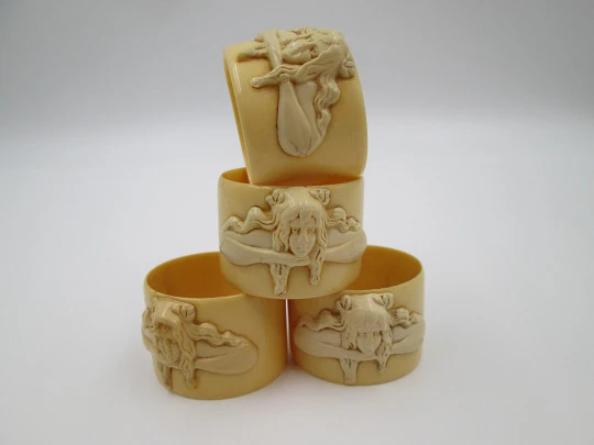 Four napkin rings set. Ivory celluloid. Modernist women's busts. Europe. 1940's