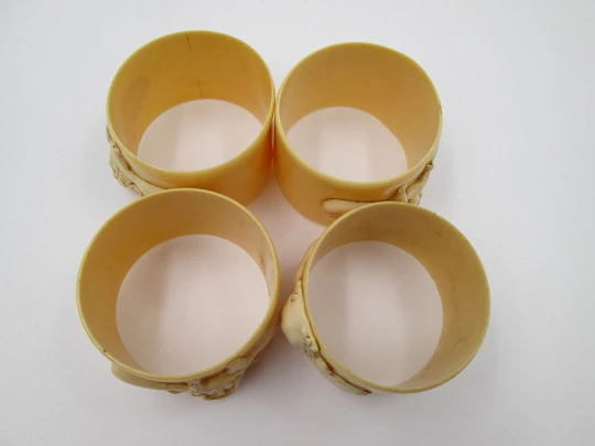 Four napkin rings set. Ivory celluloid. Modernist women's busts. Europe. 1940's