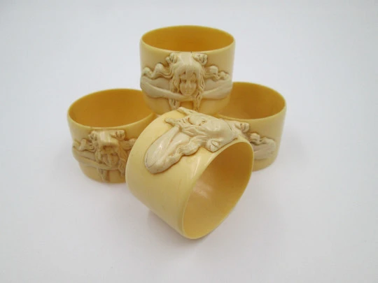 Four napkin rings set. Ivory celluloid. Modernist women's busts. Europe. 1940's