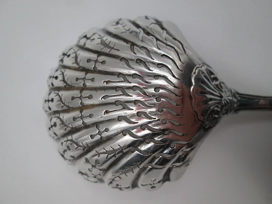 French sterling silver olive serving spoon. Ribbed motifs and shells. Openwork bowl