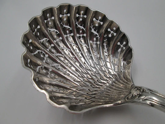 French sterling silver olive serving spoon. Ribbed motifs and shells. Openwork bowl