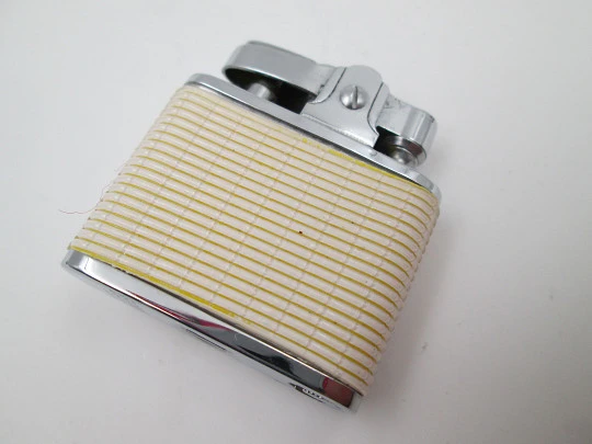 Golden Bell automatic pocket petrol lighter. Chromed plated and white resin. Japan. 1960's