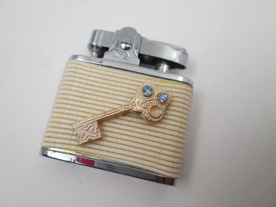 Golden Bell automatic pocket petrol lighter. Chromed plated and white resin. Japan. 1960's