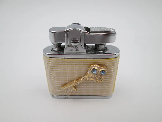 Golden Bell automatic pocket petrol lighter. Chromed plated and white resin. Japan. 1960's