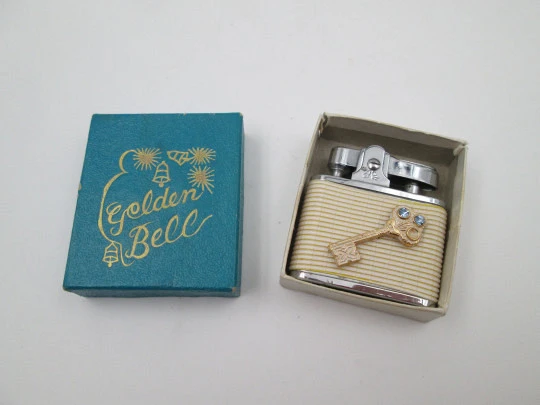 Golden Bell automatic pocket petrol lighter. Chromed plated and white resin. Japan. 1960's