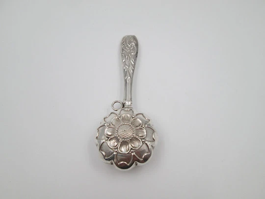 Hand baby rattle. 925 sterling silver. Floral and vegetable motifs. Ring on handle. Spain. 1990's