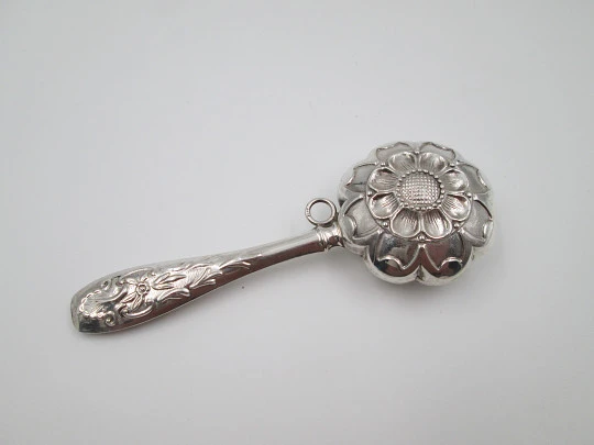 Hand baby rattle. 925 sterling silver. Floral and vegetable motifs. Ring on handle. Spain. 1990's