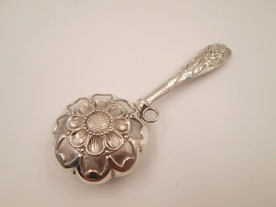 Hand baby rattle. 925 sterling silver. Floral and vegetable motifs. Ring on handle. Spain. 1990's