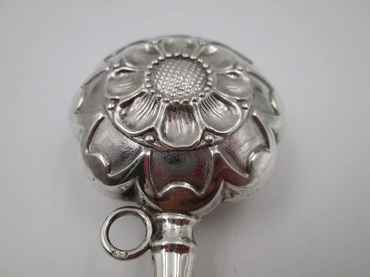 Hand baby rattle. 925 sterling silver. Floral and vegetable motifs. Ring on handle. Spain. 1990's