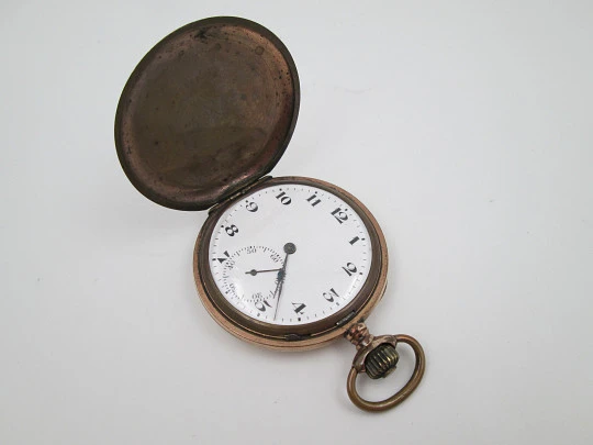 Hunter-case pocket watch. Gold plated metal. Stem winding. Porcelain dial. 1940's. Swiss