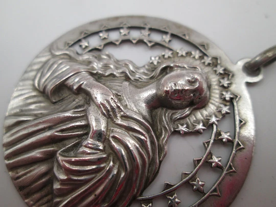 Immaculate Conception and stars openwork medal. Silver plated metal. Ring on top. 1950's