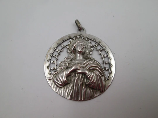 Immaculate Conception and stars openwork medal. Silver plated metal. Ring on top. 1950's