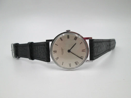 Jean Perret Genève. Steel & chromed metal. Manual winding. Leather strap. Swiss. 1960's